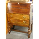 A vintage oak bureau, W. 66cm.