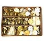 A tray of pocket watch movements.