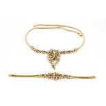 A 14ct yellow gold (stamped 585) necklace and matching bracelet set with brilliant, marquise and