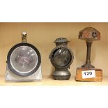 An early Uncle Sam bicycle torch, a British Rail signalling torch and a small table light.