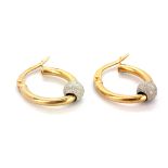 A pair of 9ct yellow and white gold hoop earrings, L. 1.6cm.