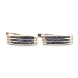 A pair of 925 silver earrings set with three rows of round cut sapphires, L. 2.1cm.