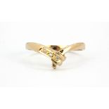 A 9ct yellow gold (stamped 9k) stone set wishbone ring, (Q).