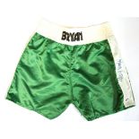 A pair of boxing shorts signed by Sir Henry Cooper.