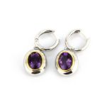 A pair of 18ct white gold (stamped 750) drop earrings set with oval cut amethysts, L. 3cm.