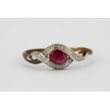 A 9ct yellow gold ruby and diamond set ring, (O.5).