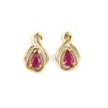 A pair of 9ct yellow gold ruby and diamond set stud earrings, L. 1.2cm