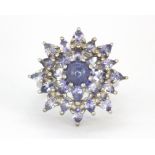 A 925 silver large cluster ring set with cabochon and pear cut tanzanites, (O).