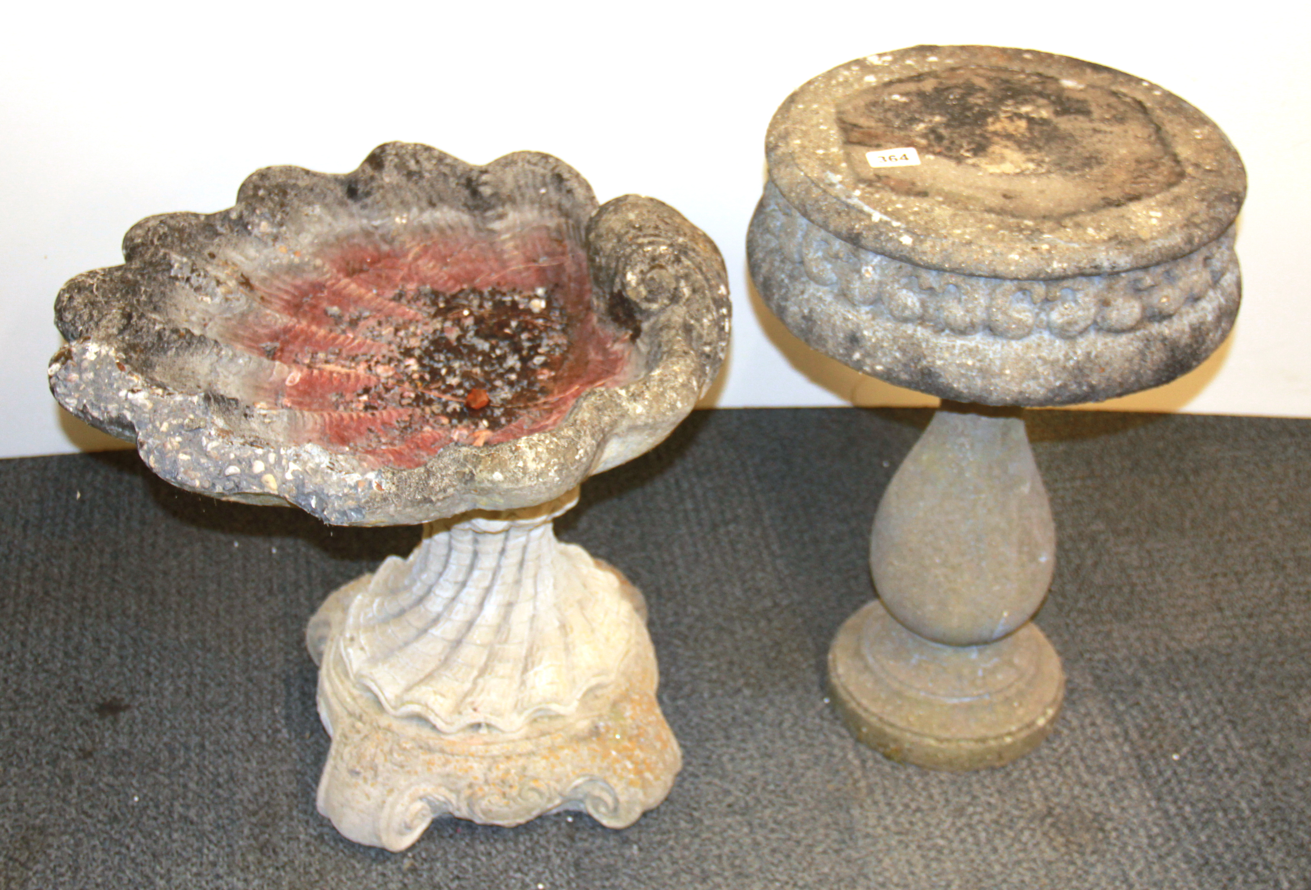 A vintage concrete garden table and shell shaped bird bath, Tallest 55cm. Condition : Shell A/F.