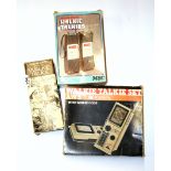 Three vintage walkie talkies.