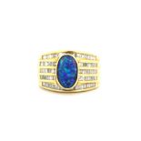 A heavy gentleman's 18ct yellow gold (stamped 18k) ring set with an opal triplet and baguette cut