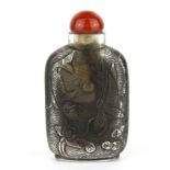 A superb Chinese carved lead crystal snuff bottle decorated with carp and lotus, H. 9.5cm. Condition