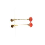A pair of 1920's 9ct yellow gold coral set drop earrings, L. 3cm.
