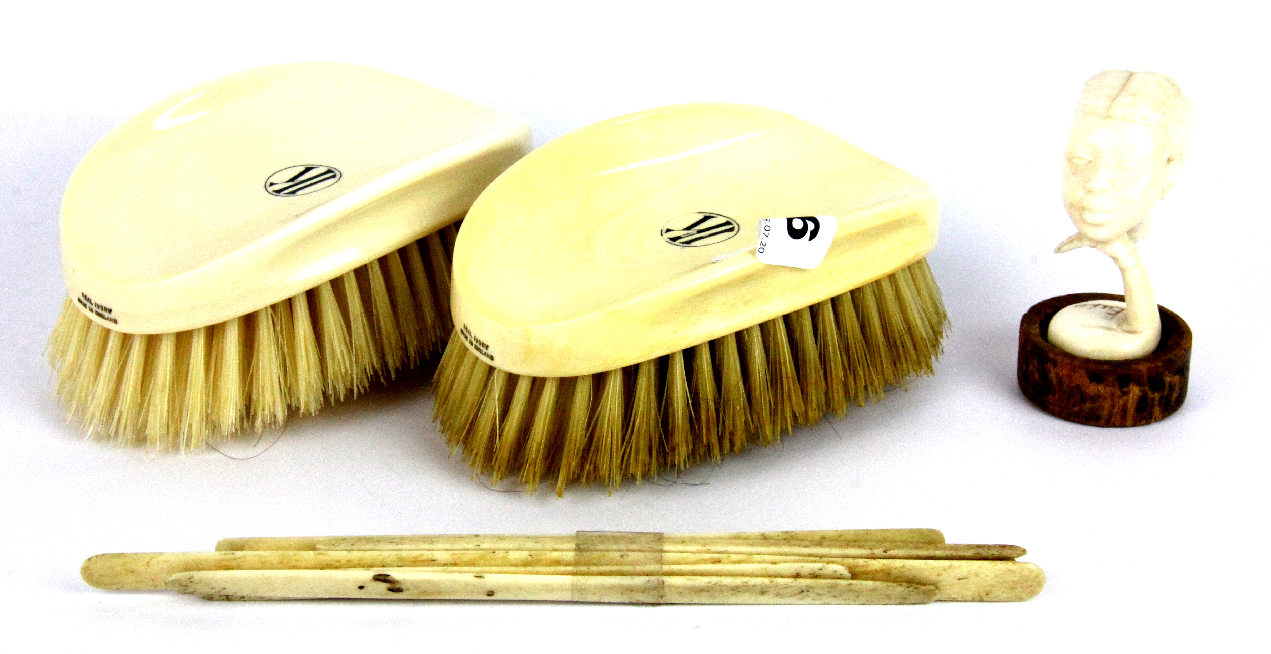 A pair of early 20th Century ivory handled gentlemen's brushes and other items.