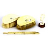 A pair of early 20th Century ivory handled gentlemen's brushes and other items.
