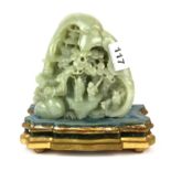 A fine 19th/ early 20th Century Chinese signed carved jade mountain scene, on a French gilt wood