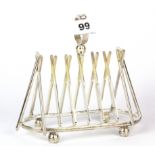 An interesting silver plated cricket bat toast rack, H. 17cm.