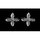 A pair of 9ct white gold diamond set flower shaped earrings, L. 0.6cm.