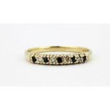 A 9ct yellow gold sapphire and diamond set half eternity ring, (O).