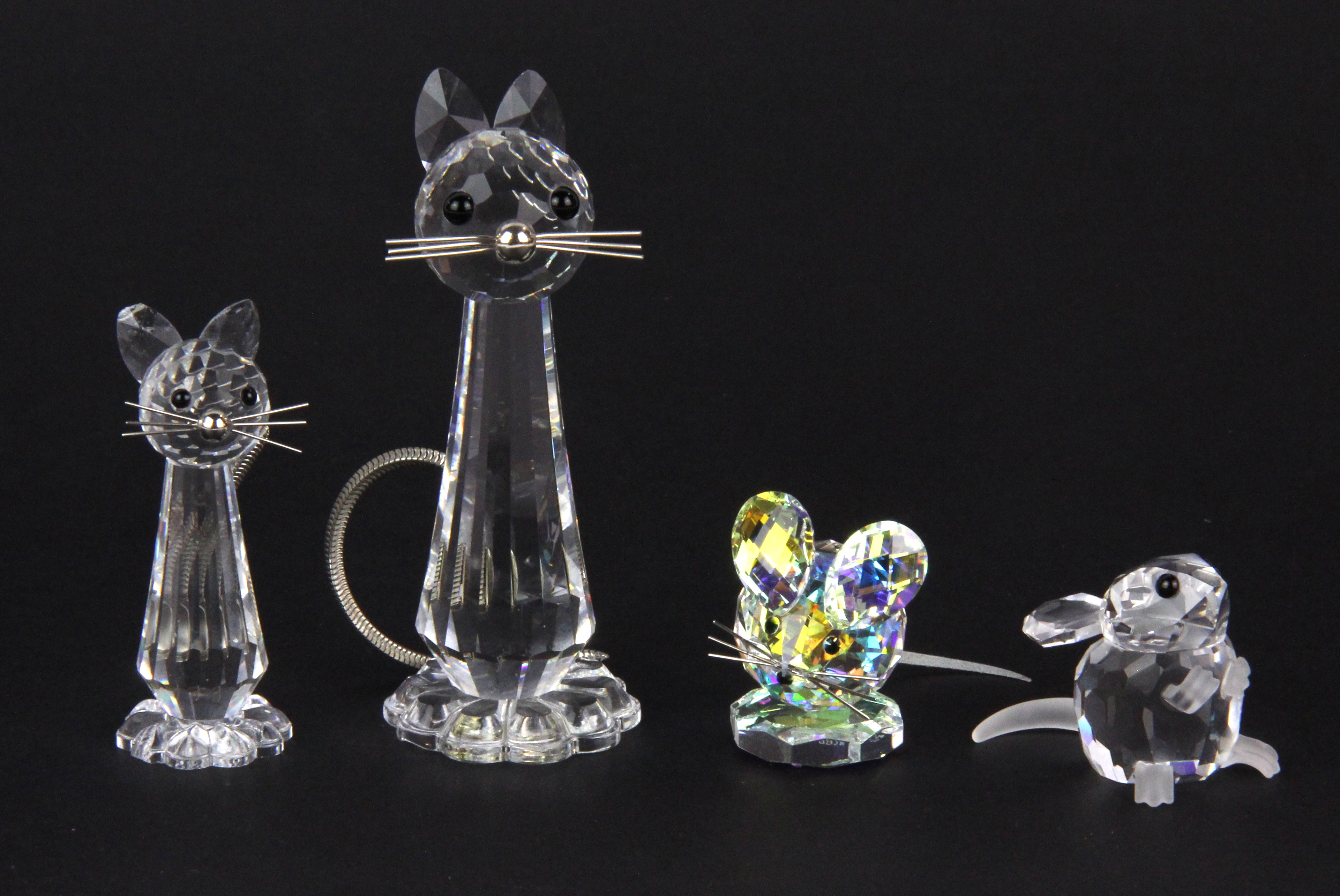 Boxed Swarovski crystal figures of two cats and two mice, tallest H. 8cm.
