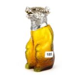 An interesting silver plated and amber glass bear claret jug with glass eyes, H. 22cm.