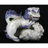 A rare Japanese Hirado porcelain figure of two lion dogs fighting, H. 25cm. Condition :