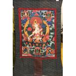 A Tibetan hand painted silk mounted Thangka of the White Tara, W. 83cm H. 120cm. Condition: good,