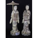 A pair of carved bone figures of Japanese women, tallest 31cm.