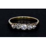 An 18ct yellow gold ring set with five graduated brilliant cut diamonds, approx. 0.65ct overall, (