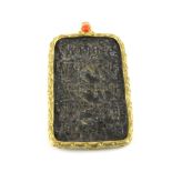 A Tibetan gilt mounted bronze amulet with coral bead decoration, H. 7.5cm.