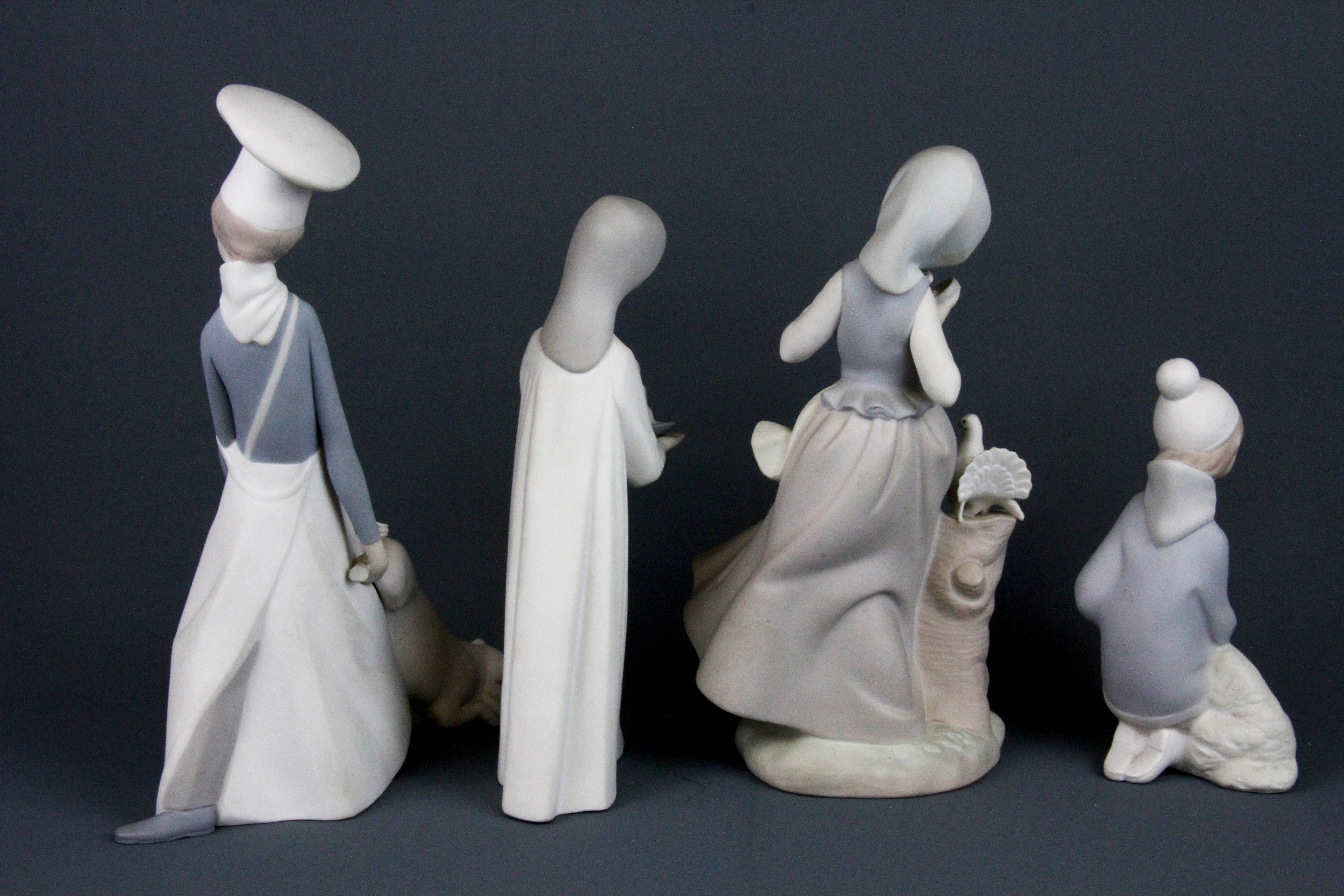 Four Lladro bisque porcelain figures of children, tallest 24cm. Condition: candle stick detached - Image 2 of 3