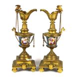 A pair of 19th Century French porcelain and gilt bronze garnitures, H. 28cm.