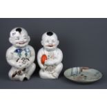 Two mid-20th Century Chinese porcelain figures of baby boys, together with an erotic decorated