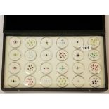 A box containing over 50 unmounted mixed gemstones, including diamond, pink sapphire, peridot,