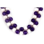 A long polished amethyst bead and cultured pearl necklace, L. 120cm.