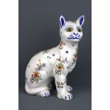 An interesting French faience figure of a cat with glass eyes, H. 30cm. Condition: good with no