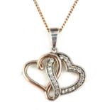 A 925 silver rose gold gilt heart shaped pendant and chain.