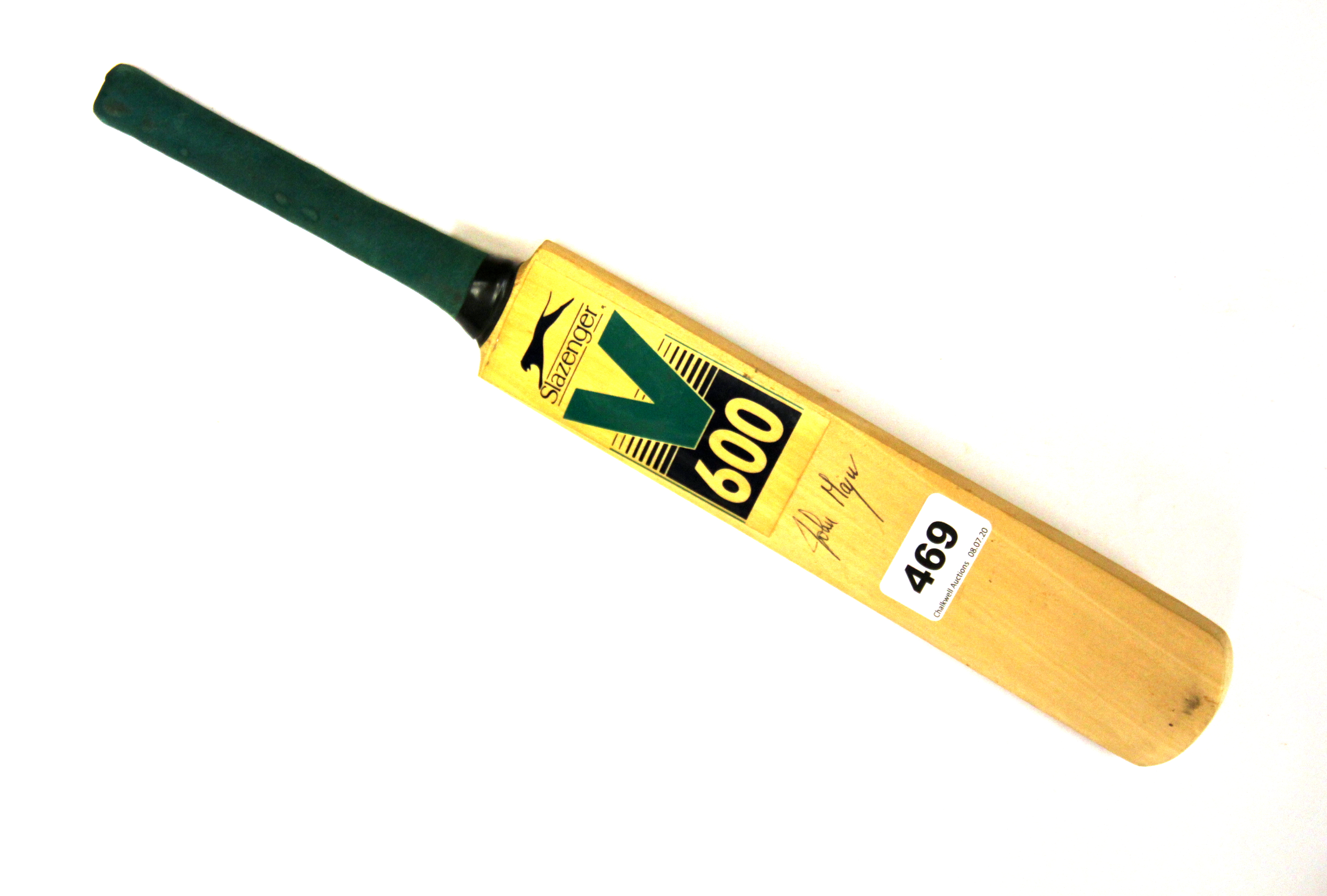 A miniature cricket bat signed by former Prime Minister John Major.