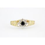 A 9ct yellow gold sapphire and white stone set ring, (Q).