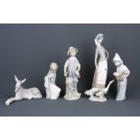 Five Lladro bisque porcelain figures of children and a donkey, tallest 23cm. Condition: Stick