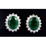 A pair of 18ct yellow gold (stamped 750) large cluster earrings set with oval cut emeralds and