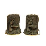 A pair of 1920's bronze bookends, H. 14cm.