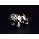 A small sterling silver bulldog pin cushion, L. 3.5cm H. 2cm.