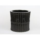 A Chinese carved black hardwood brush pot in the form of a bundle of bamboo stems, H 15cm D 16cm.
