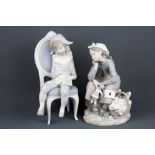 Two Lladro bisque porcelain figures of child dressed as a harlequin and a girl with a doll, H.
