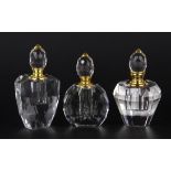 Three attractive perfume bottles, tallest 10cm.