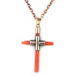 A 9ct yellow gold (stamped 9ct) mounted coral cross pendant and chain, approx. 6gr overall.