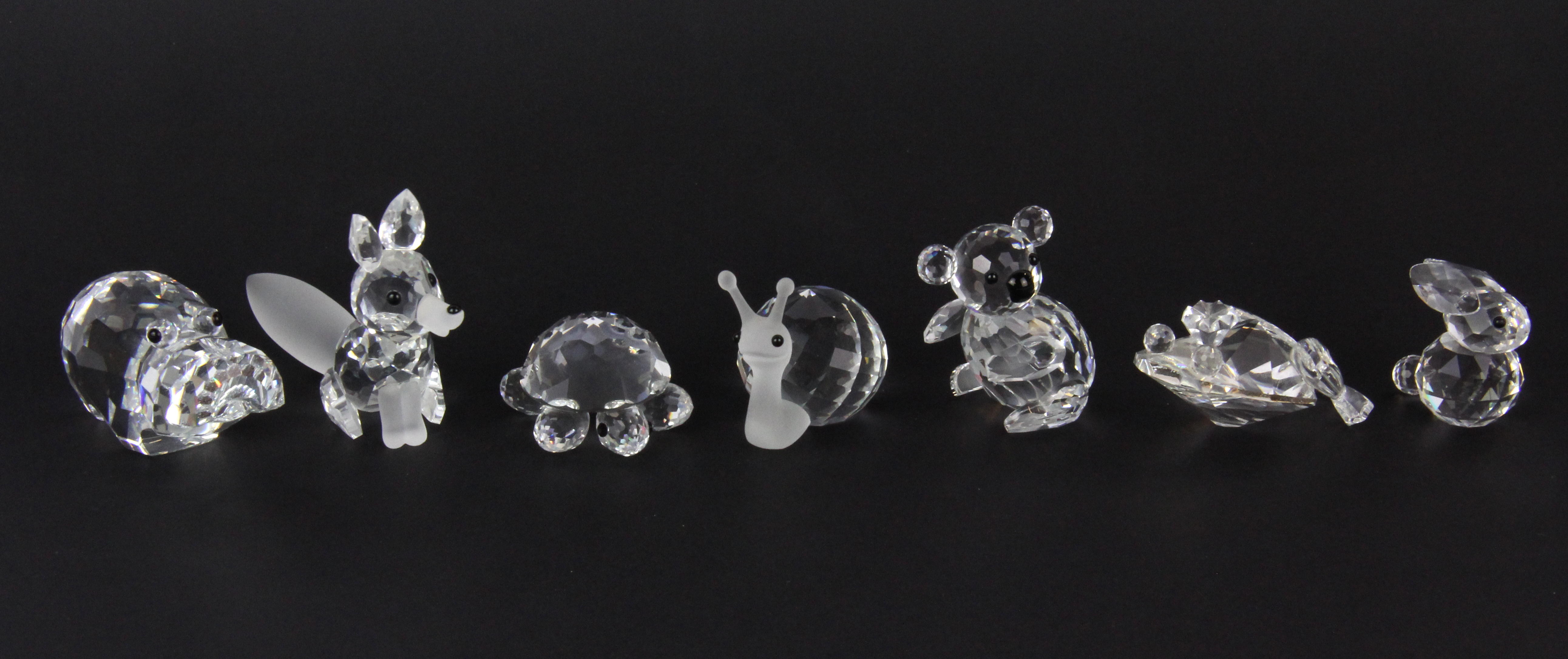 Seven small boxed Swarovski crystal figures, fox H. 5.5cm.