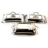 Three silver plated serving tureens with lids and handles, largest size 29 x 21cm.