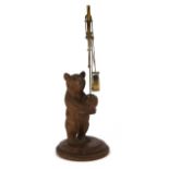 A carved Blackforest bear balance scale, bear H. 12.5cm, scale H. 22cm. Condition : No pan.